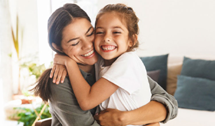 Mother and daughter hugging