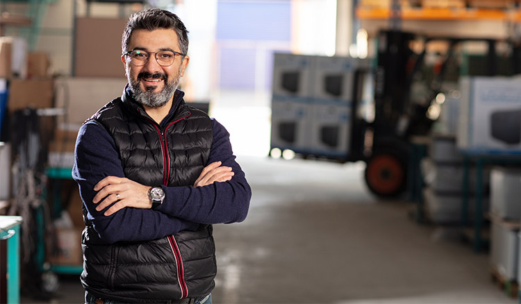 Caucasian Male Standing In Warehouse